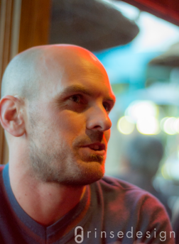Sometimes you just luck out. The one random shot I took of Paul chatting at the bar turned out to be a fascinating portrait that captured his purposeful nature